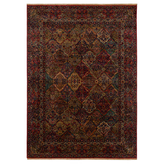 A traditional oriental-style area rug with an intricate pattern of interlocking lozenge medallions in deep red, navy blue, brown, and beige tones in a fine, hand-knotted quality of New Zealand wool pile.