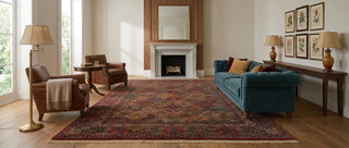 A traditional oriental-style area rug with an intricate pattern of interlocking lozenge medallions in deep red, navy blue, brown, and beige tones in a fine, hand-knotted quality of New Zealand wool pile.