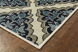 Oriental Weavers Linden 7816B Ivory/ Blue Area Rug Corner On Wood