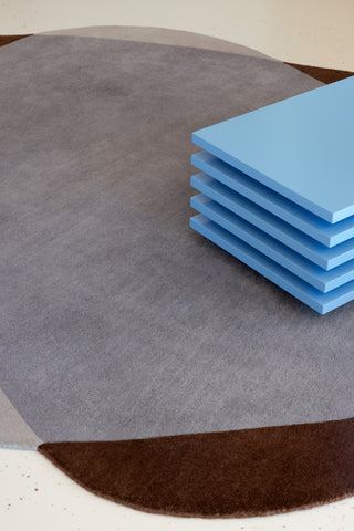 Brink and Campman Element Chad Brown Blue Area Rug Room Image Feature