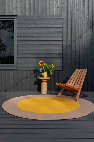 Brink and Campman Habitat Festival Round Yellow Area Rug Round Room Image Feature