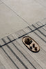 Brink and Campman Zona Line Charcoal Area Rug Room Image Feature