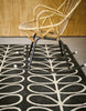 Brink and Campman Linear Stem Slate Area Rug by Orla Kiely Room Image Feature