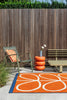 Brink and Campman Linear Stem Orange Area Rug by Orla Kiely Room Image Feature