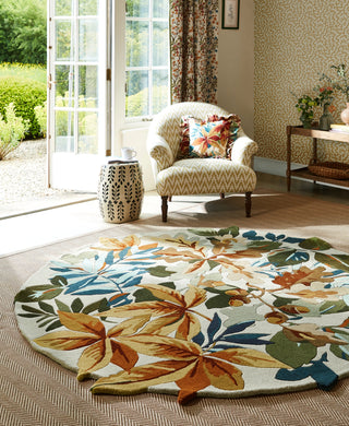 Brink and Campman Robin's Wood Russet Brown Area Rug by Sanderson Round Room Image Feature