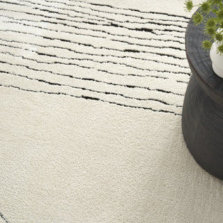 Nourison Cozy Modern CMD02 Ivory Black Area Rug Corner Image