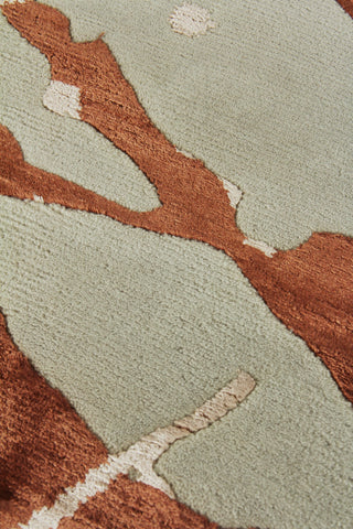 Exquisite Rugs Space Age 2503 Copper/Ivory Area Rug by The Met Closeup Image