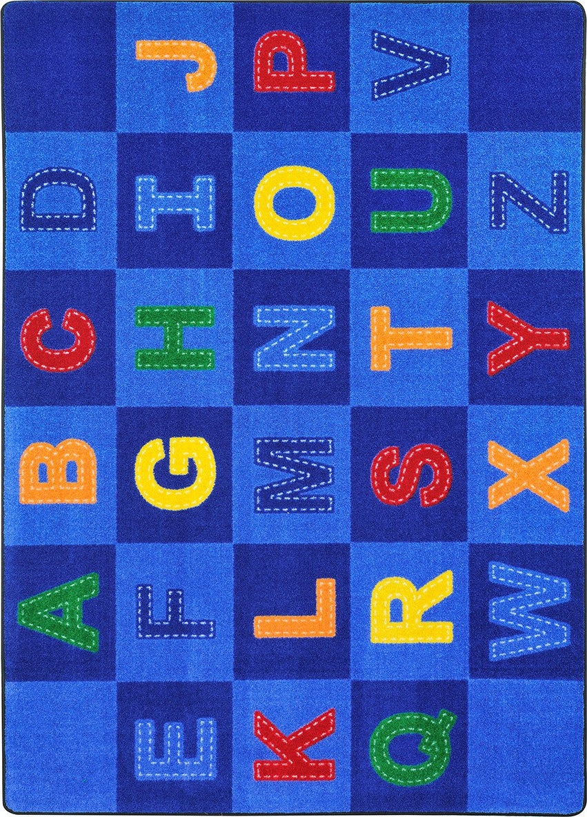 Joy Carpets Kid Essentials Patchwork Letters Multi Area Rug