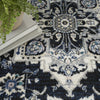 Nourison Passion PSN33 Black Ivory Area Rug Corner Image