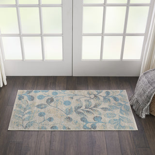 Tranquil TRA03 Ivory/Turquoise Area Rug by Nourison Corner Image