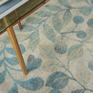 Tranquil TRA03 Ivory/Turquoise Area Rug by Nourison Corner Image