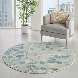 Tranquil TRA03 Ivory/Turquoise Area Rug by Nourison Corner Image