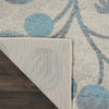 Tranquil TRA03 Ivory/Turquoise Area Rug by Nourison Corner Image