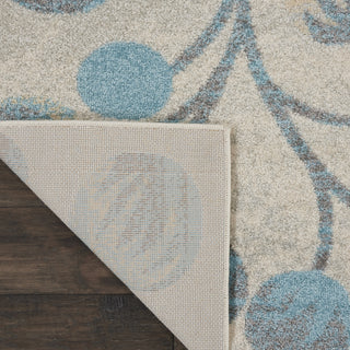 Tranquil TRA03 Ivory/Turquoise Area Rug by Nourison Corner Image