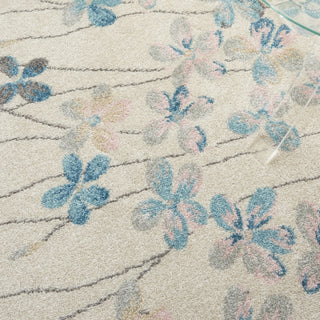 Tranquil TRA04 Ivory Area Rug by Nourison Corner Image