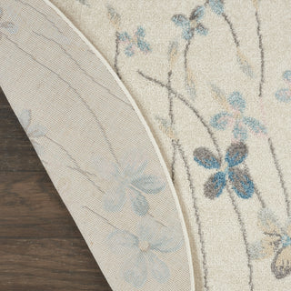 Tranquil TRA04 Ivory Area Rug by Nourison Corner Image
