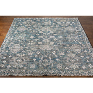 Surya Almeria ALM-2303 Area Rug on wood floor