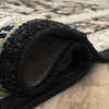 Karastan Zephyr Amphora Black Area Rug Curled