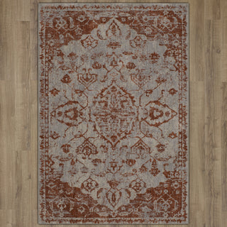 Karastan Soiree Kamo Rose Gold Area Rug on Wood 