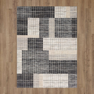 Karastan Vanguard by Drew and Jonathan Home Resolute Frost Grey Area Rug on Wood 