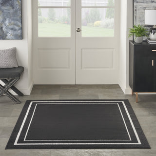 Nourison Essentials NRE02 Black Ivory Area Rug Room Image