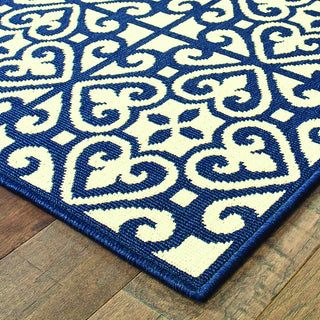 Oriental Weavers Marina 5927B Ivory/Navy Area Rug Corner On Wood