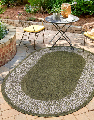 Unique Loom Outdoor Border T-KZOD1 Green Area Rug Oval Lifestyle Image