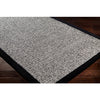Surya Siena SNA-2303 Area Rug on wood floor