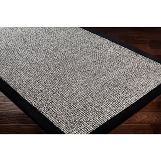 Surya Siena SNA-2303 Area Rug on wood floor